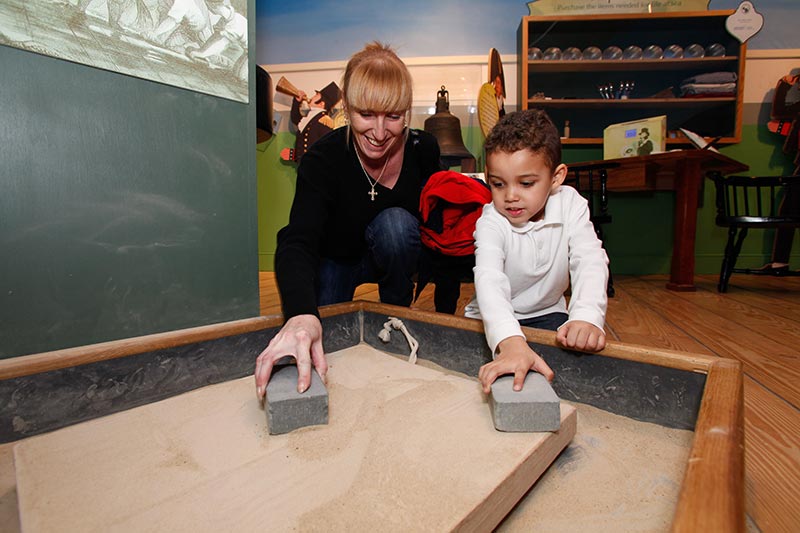 Mother and son using exhibit